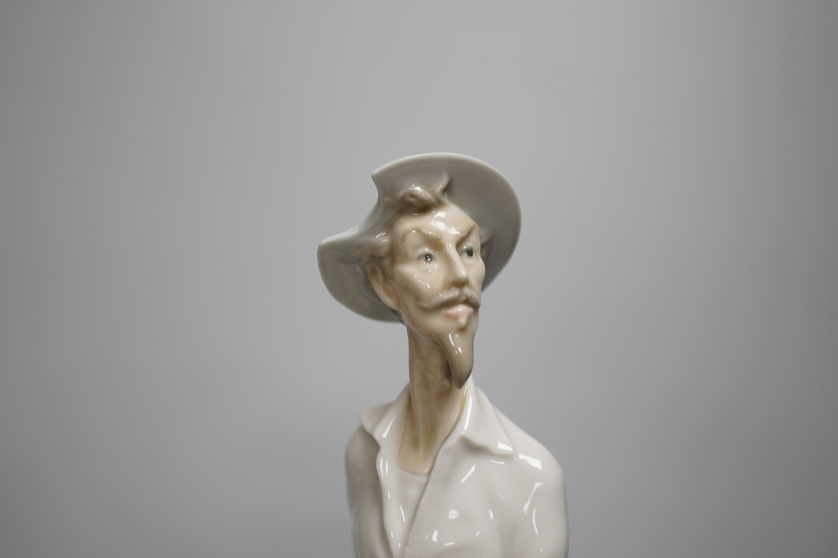 A large Lladro figure of a seated mother and child, a pierrot and ballerina, peasant woman and child, a grandmother and child and two others including a Nao example, the largest 30cm high (6)